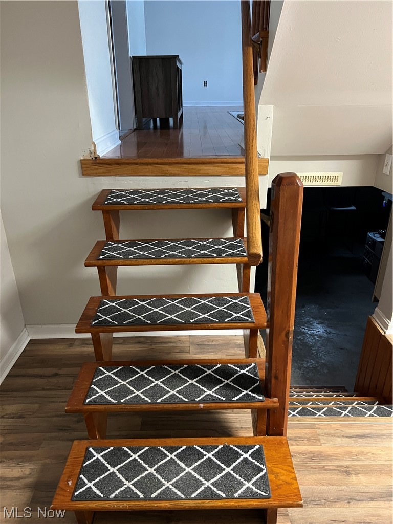 3215 Warren - Sharon Road Vienna, OH 44473 - Photo 11 of 25 Staircase featuring dark wood-type flooring
