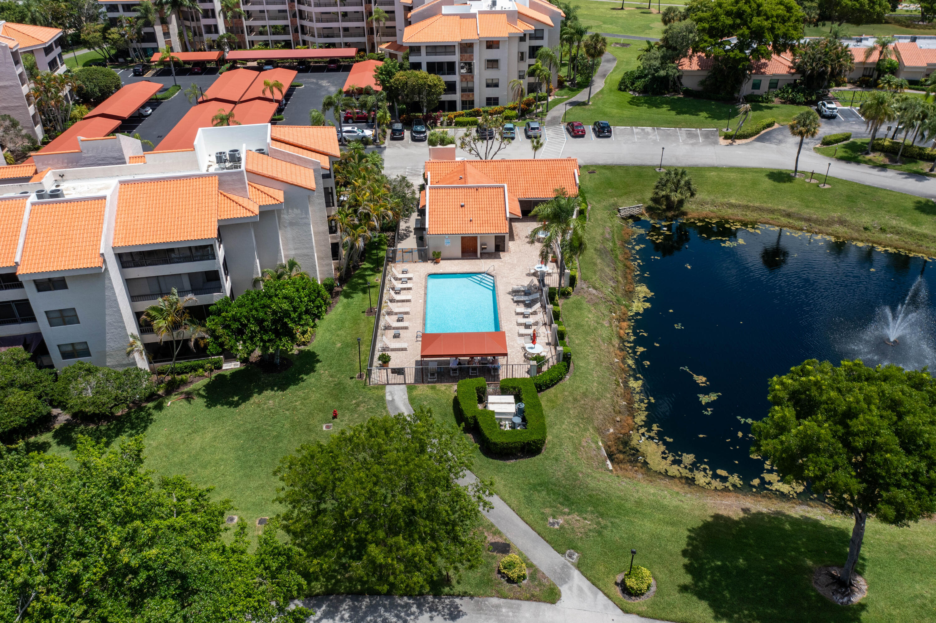 7520 La Paz Boulevard, Unit 104 Boca Raton, FL 33433 - Photo 44 of 56 an aerial view of multiple houses with yard