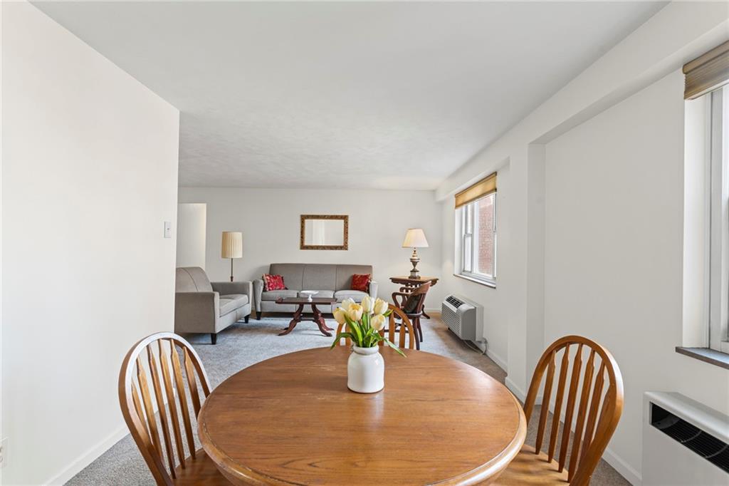 4601 Fifth Avenue, Unit 525 Pittsburgh, PA 15213 - Photo 12 of 35 a dining room with furniture and wooden floor
