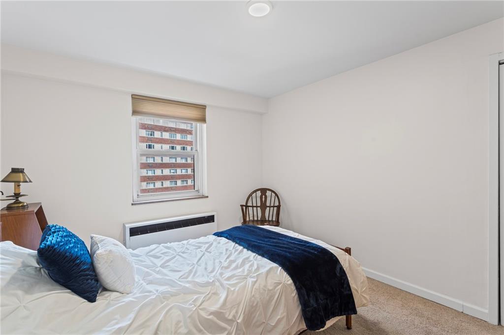 4601 Fifth Avenue, Unit 525 Pittsburgh, PA 15213 - Photo 20 of 35 a bedroom with a bed and a window