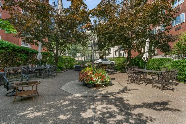 a backyard of a house with outdoor seating