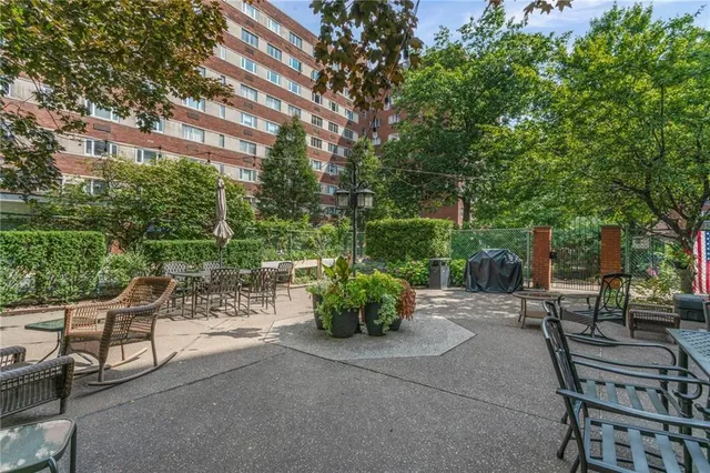 a view of backyard with patio and outdoor seating