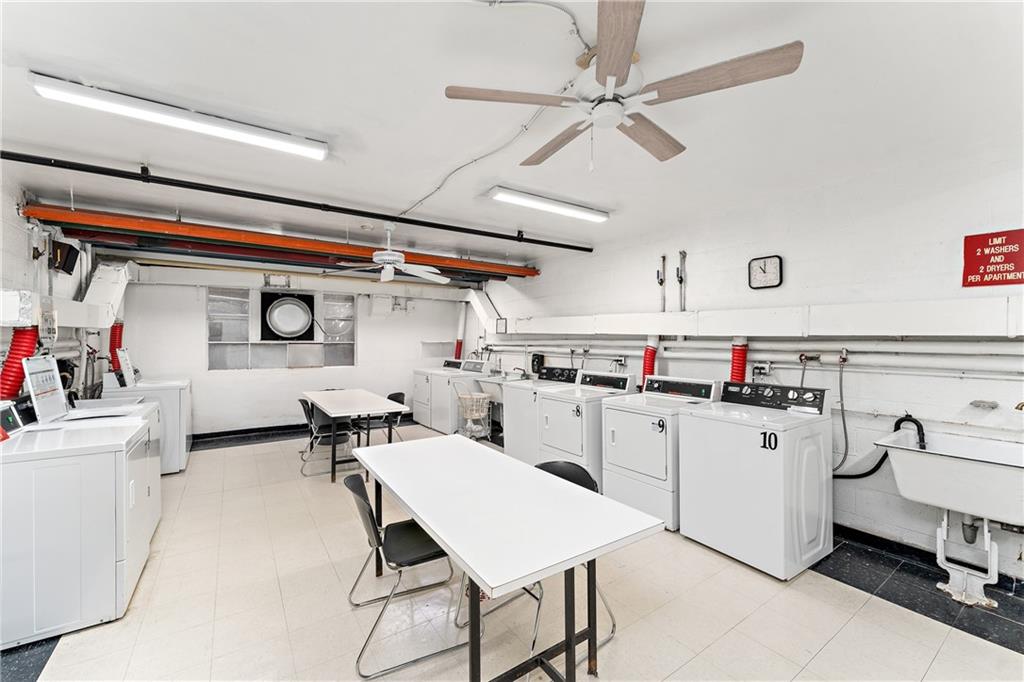 4601 Fifth Avenue, Unit 525 Pittsburgh, PA 15213 - Photo 26 of 35 a kitchen with a sink a stove and white cabinets