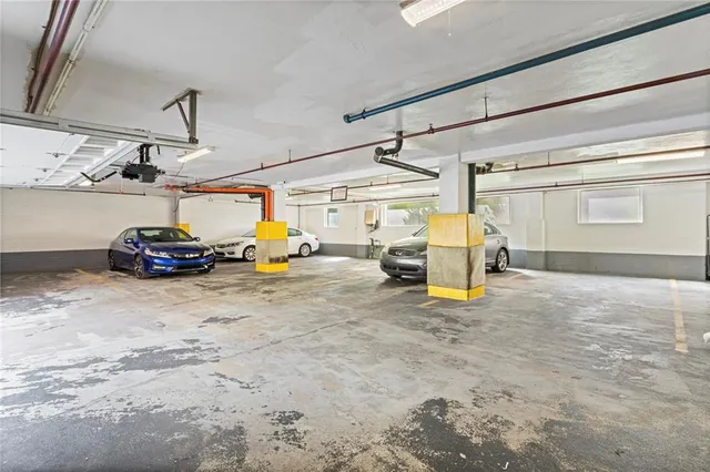 a view of a patio with table and chairs potted plants and wooden fence