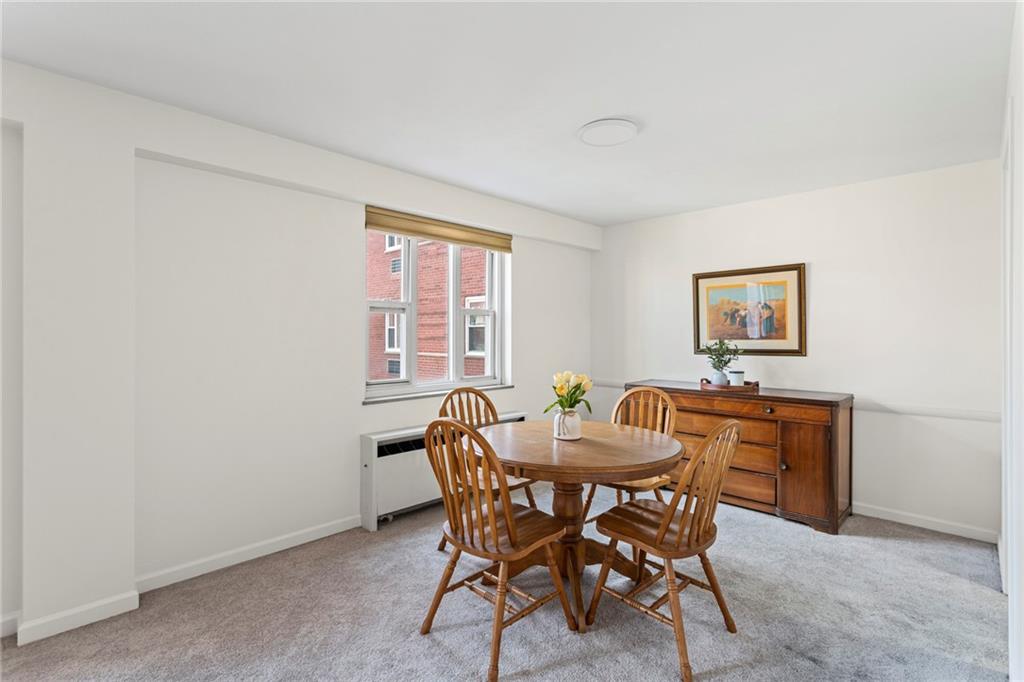 4601 Fifth Avenue, Unit 525 Pittsburgh, PA 15213 - Photo 9 of 35 a view of a dining room with furniture and window