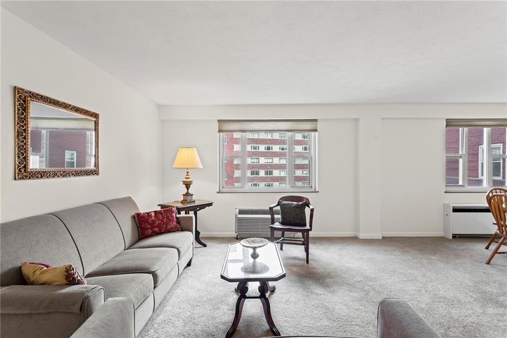 4601 Fifth Avenue, Unit 525 Pittsburgh, PA 15213 - Photo 10 of 35 a living room with furniture and a window
