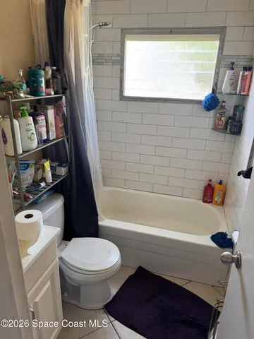 a bathroom with a sink a toilet and a bathtub