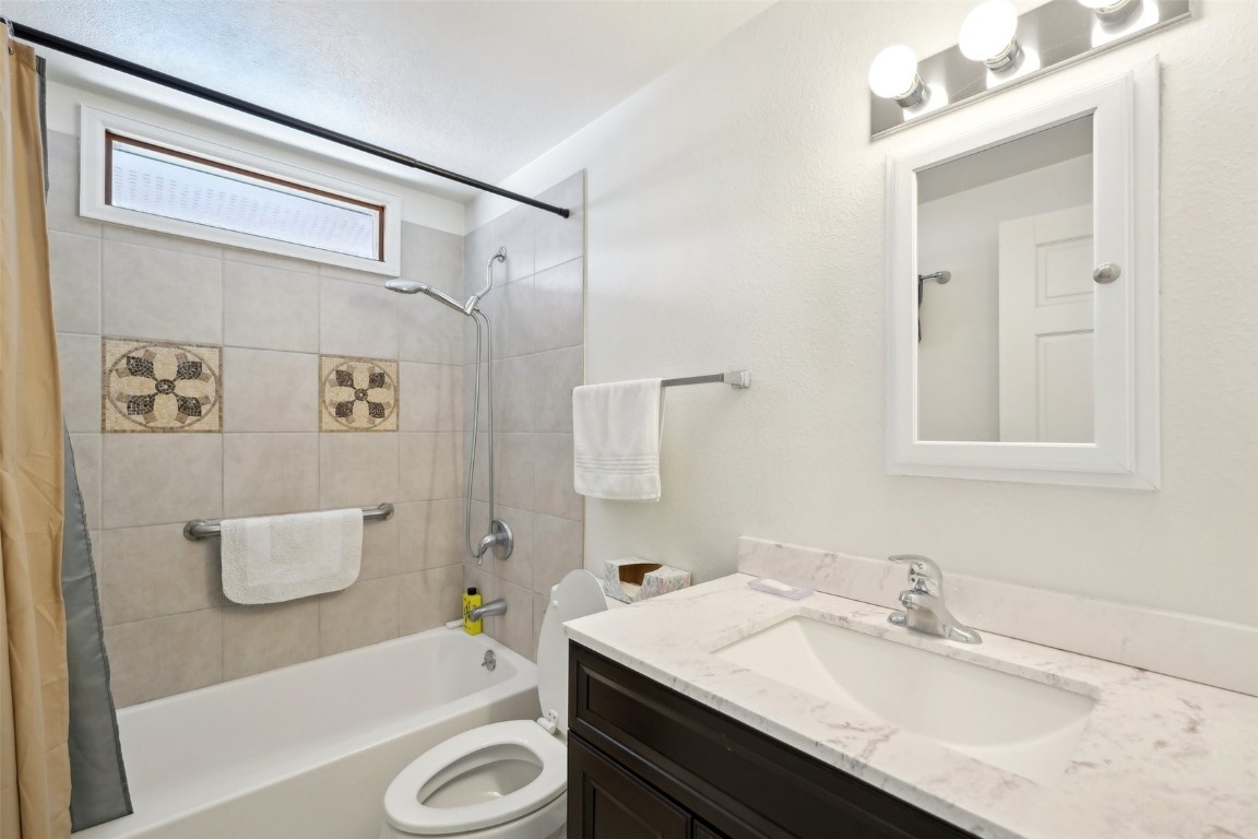 416 Cascade Circle Silverthorne, CO 80498 - Photo 13 of 49 Full bath featuring toilet, vanity, and shower / bath combination with curtain