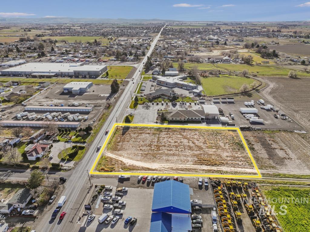 Aerial overview of property's location with property boundaries highlighted and industrial structures