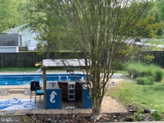 102 Worcester Road Stevensville, MD 21666 - Photo 25 of 38 Tiki Bar and Saltwater Inground Pool with new line