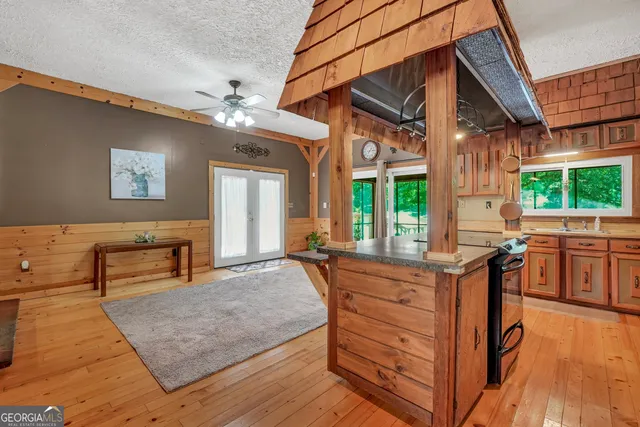 a view of an empty room with a ceiling fan