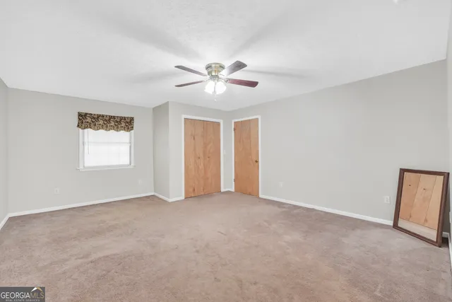 a aerial view of a house with a yard