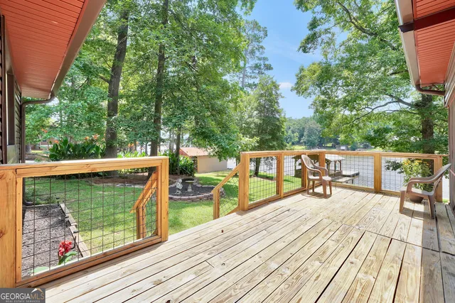 a view of a house with yard and sitting area