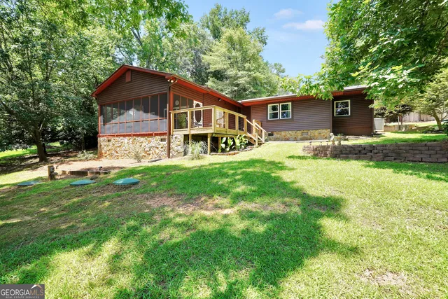 a view of swimming pool with a yard and sitting area
