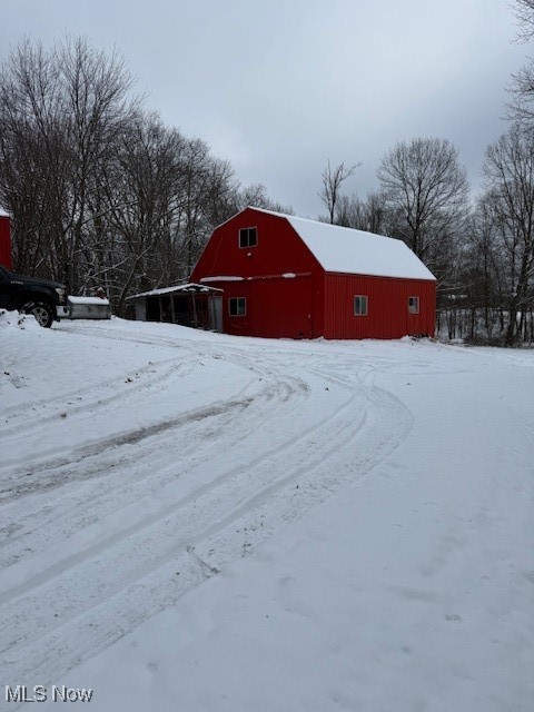 15639 Grove Road Southwest Port Washington, OH 43837 - Photo 9 of 31 Snow covered structure with a barn