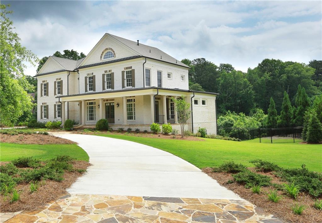 10777 Polly Taylor Road Johns Creek, GA 30097 - Photo 1 of 1 Stunning executive home in gated community with top schools. John Wieland integrity and design with finished terrace level and expansive fenced yard ready for pool.