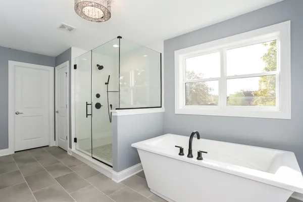 a spacious bathroom with a double vanity sink mirror and