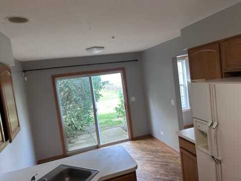 2456 Frost Drive Aurora, IL 60503 - Photo 11 of 12 a view of room with window and a kitchen