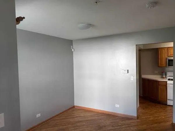 a view of a kitchen from the hallway