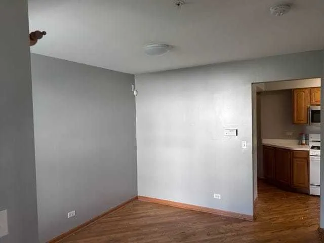 a view of a kitchen from the hallway
