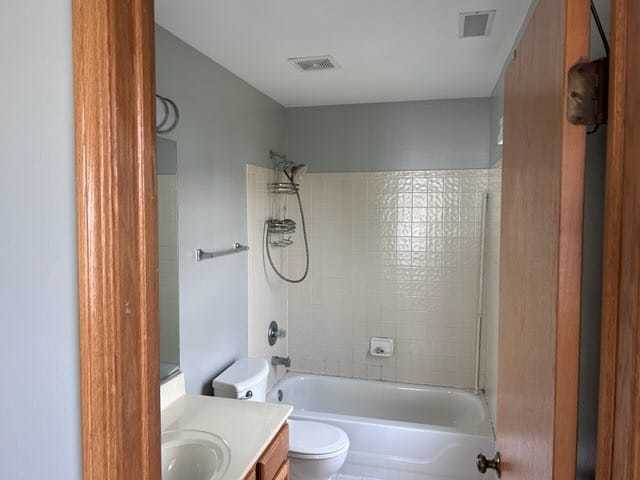 2456 Frost Drive Aurora, IL 60503 - Photo 7 of 12 a bathroom with a granite countertop bathtub shower sink and toilet
