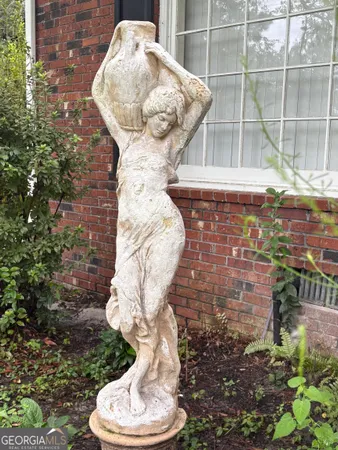 a sign that is on a brick wall