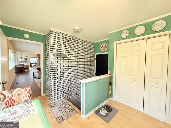 a view of a hardwood and front door