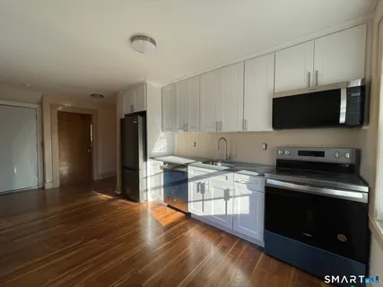 a kitchen with a stove and a microwave