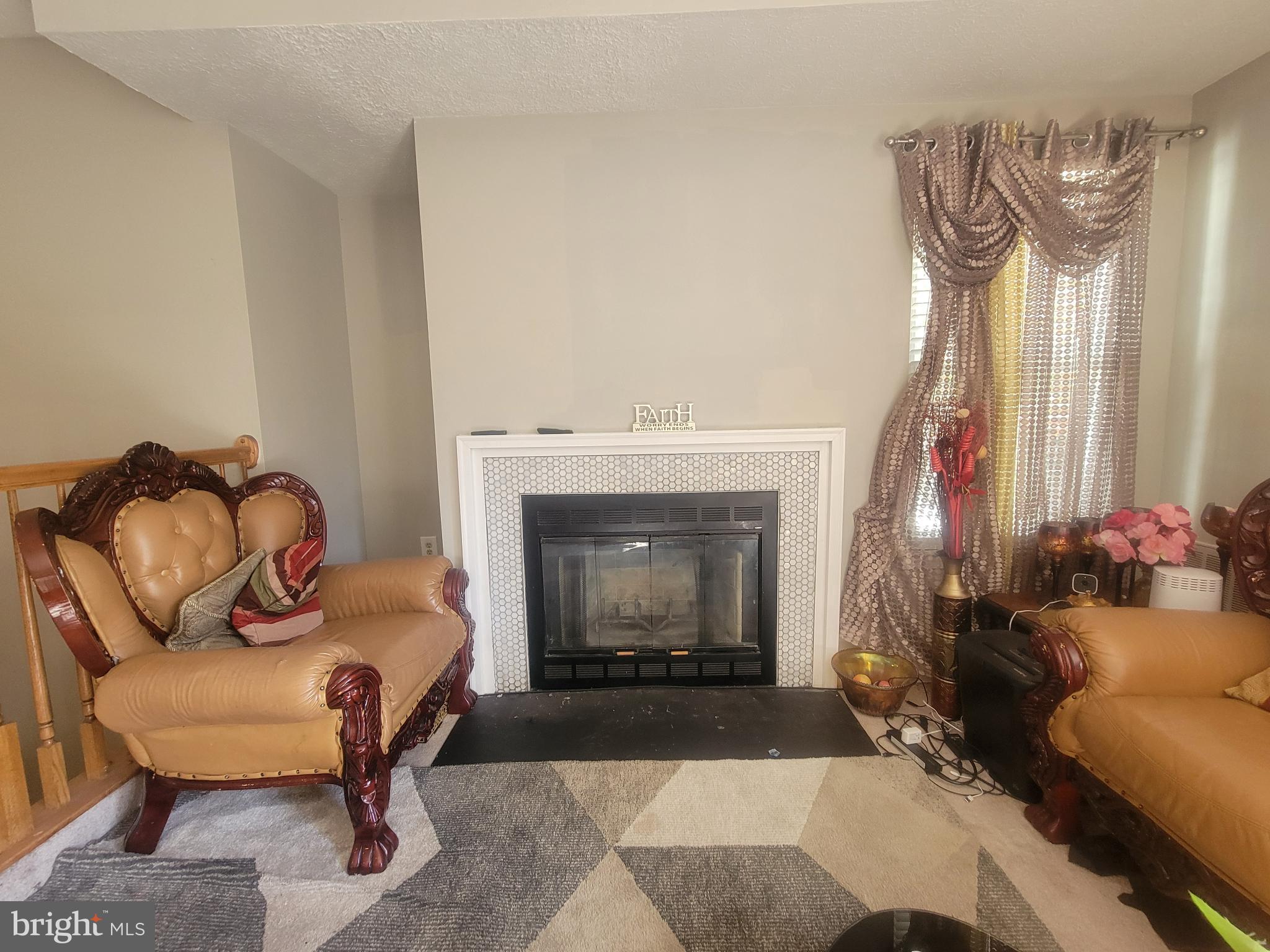 4634 Deepwood Court, Unit 89E Bowie, MD 20720 - Photo 11 of 29 a living room with furniture and a fireplace