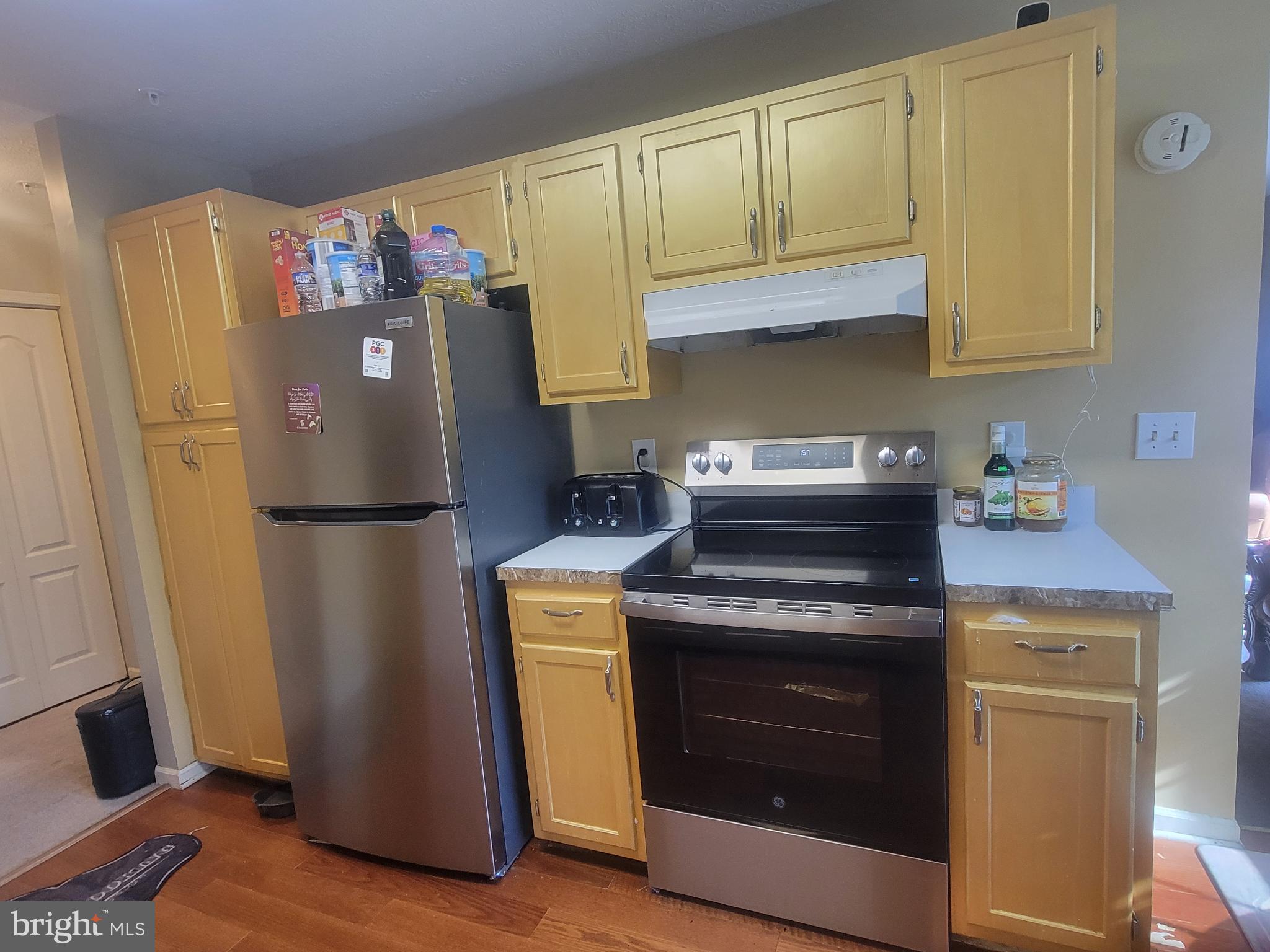 4634 Deepwood Court, Unit 89E Bowie, MD 20720 - Photo 17 of 29 a kitchen with a refrigerator sink and stove