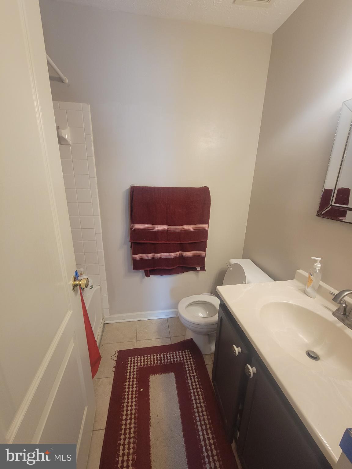 4634 Deepwood Court, Unit 89E Bowie, MD 20720 - Photo 20 of 29 a bathroom with a sink and a mirror