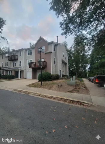 a view of a street with a house