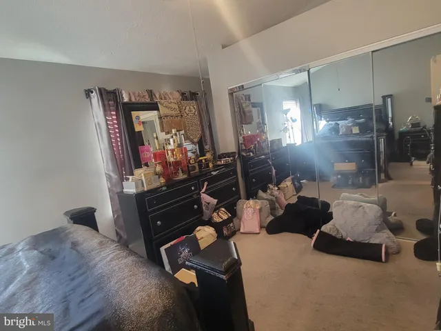 a room with a dresser and a mirror
