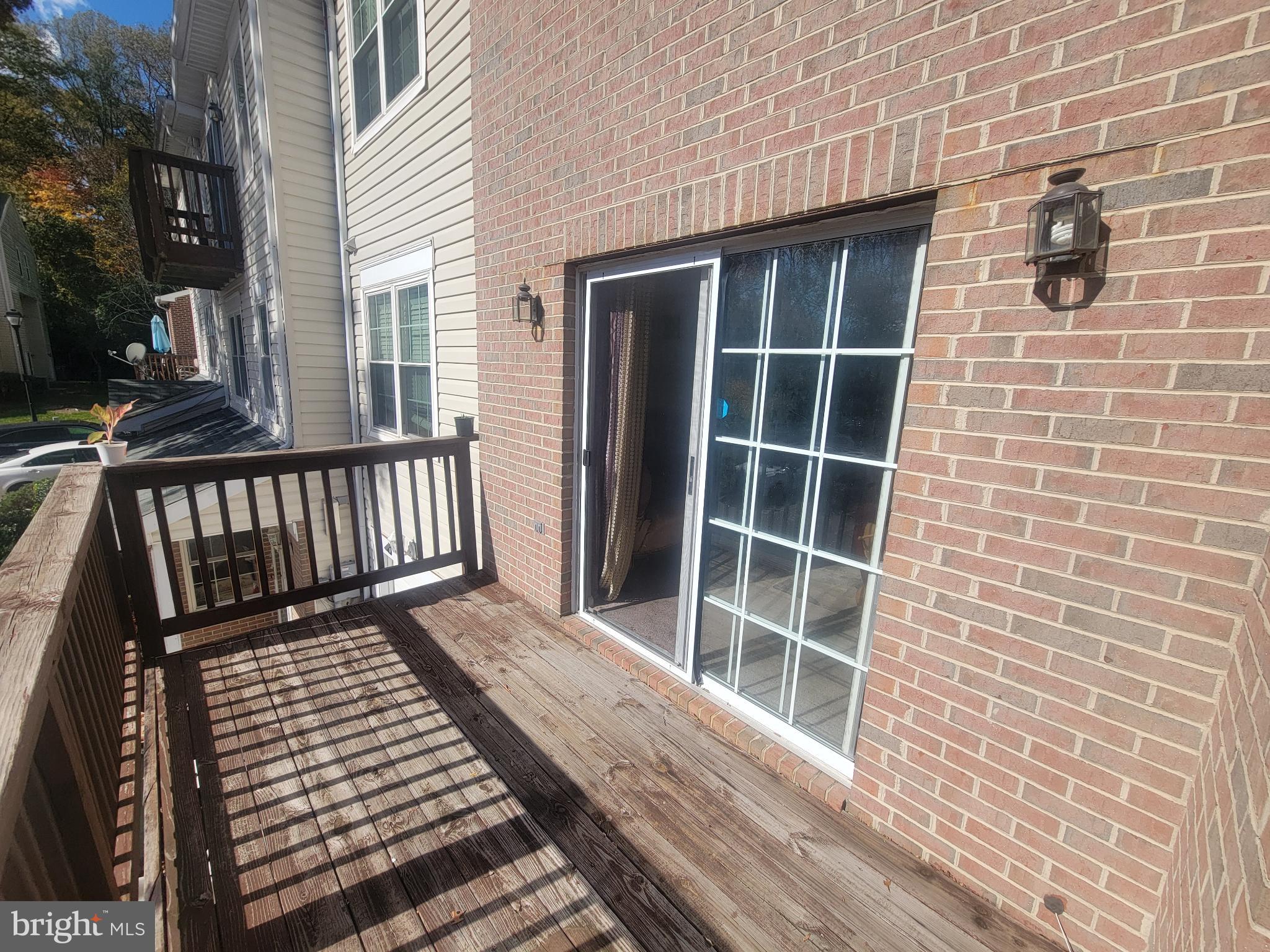 4634 Deepwood Court, Unit 89E Bowie, MD 20720 - Photo 7 of 29 a view of a balcony with wooden floor