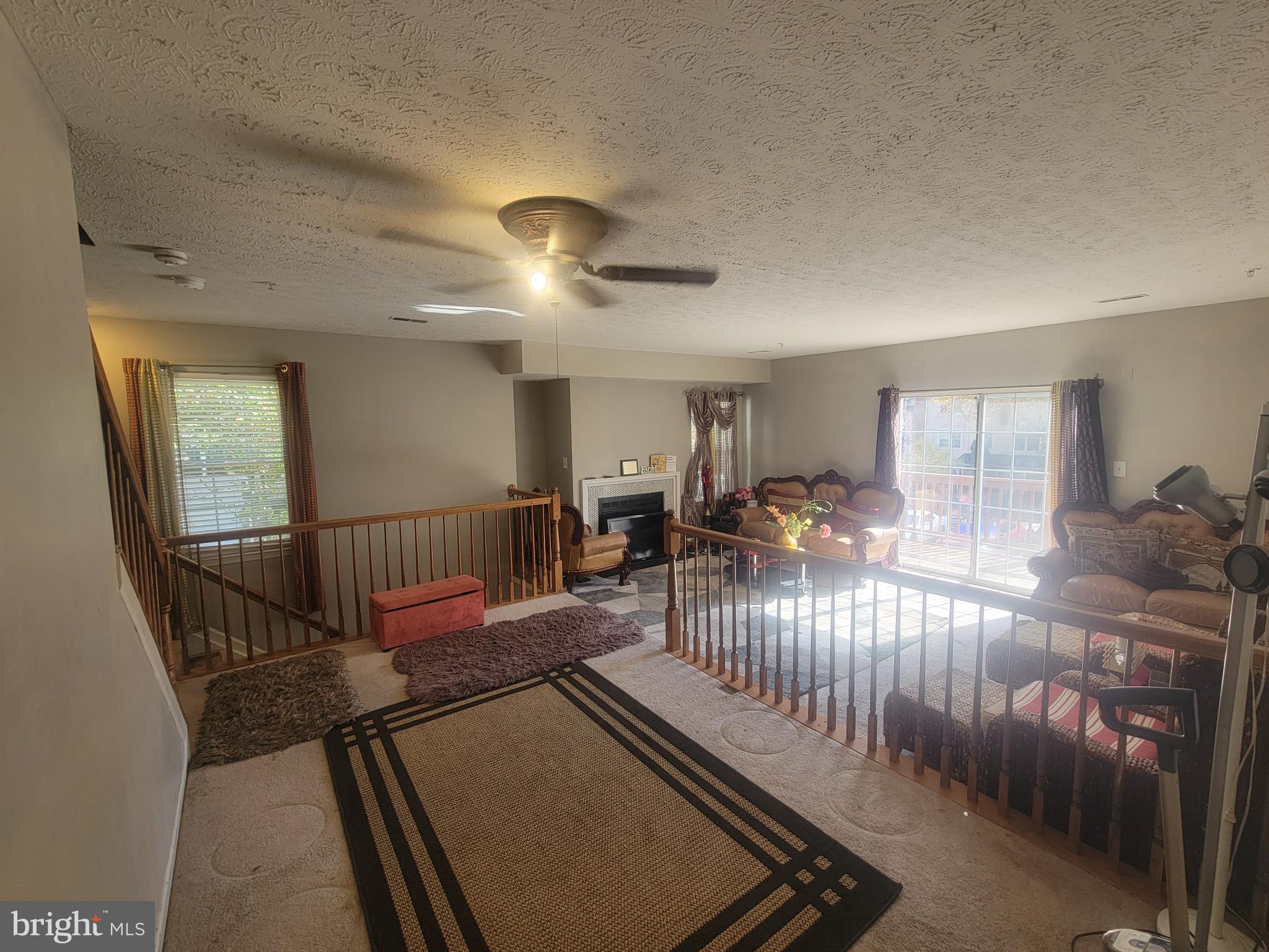 4634 Deepwood Court, Unit 89E Bowie, MD 20720 - Photo 9 of 29 a view of a livingroom with furniture and a rug