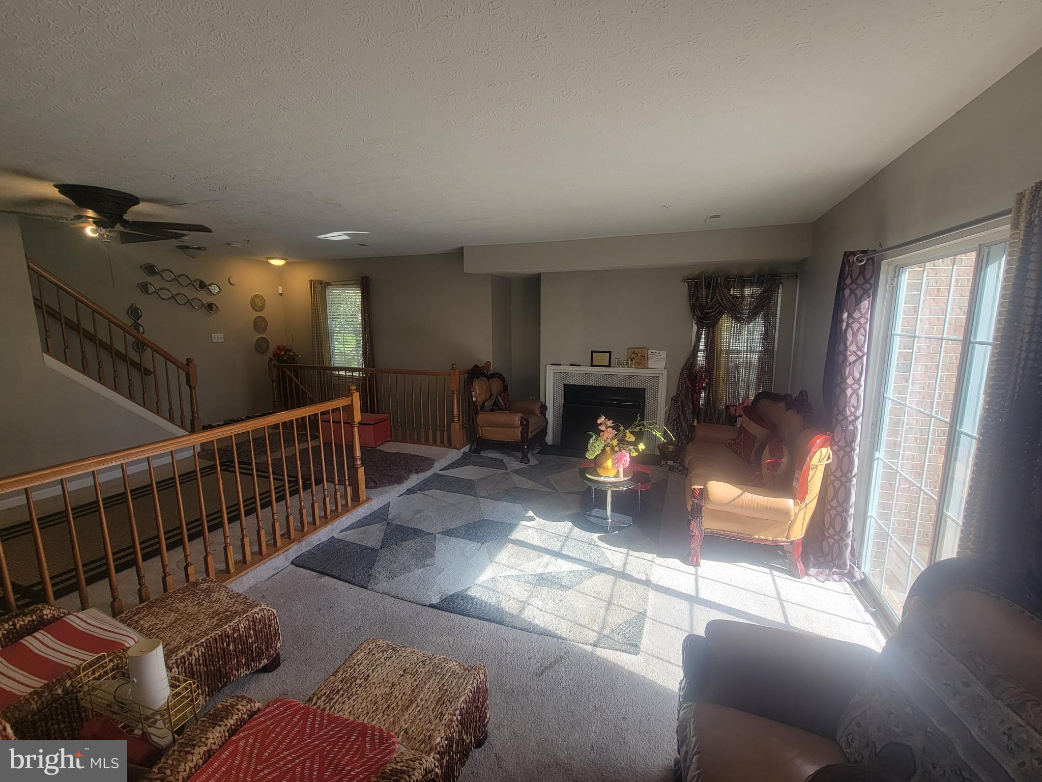 4634 Deepwood Court, Unit 89E Bowie, MD 20720 - Photo 10 of 29 a living room with furniture and a fireplace