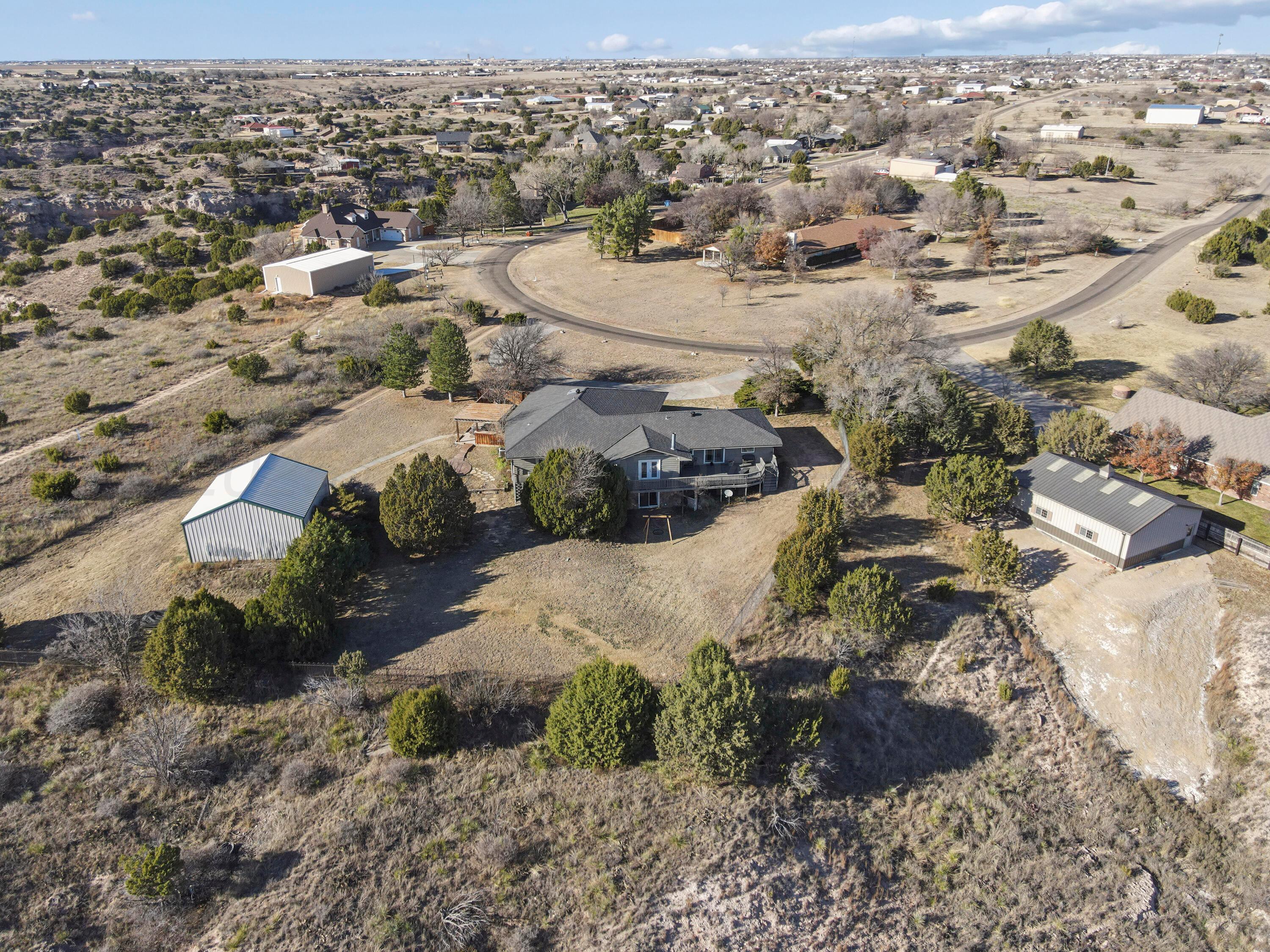 13901 Tangle Aire Point Amarillo, TX 79118 - Photo 52 of 55 an aerial view of residential houses with outdoor space