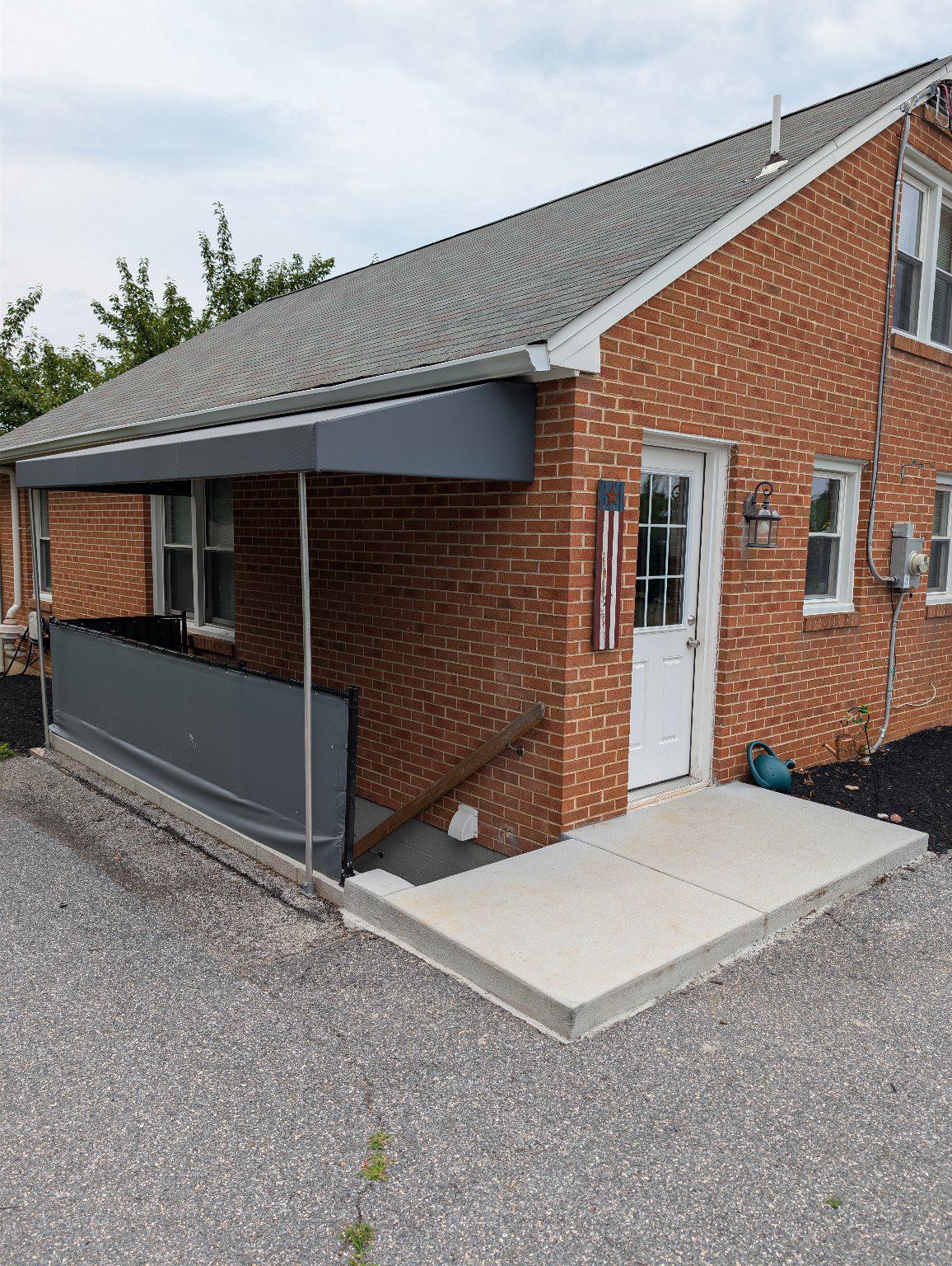 105 Warfieldsburg Road Westminster, MD 21157 - Photo 29 of 34 New awning and concrete going to lower level