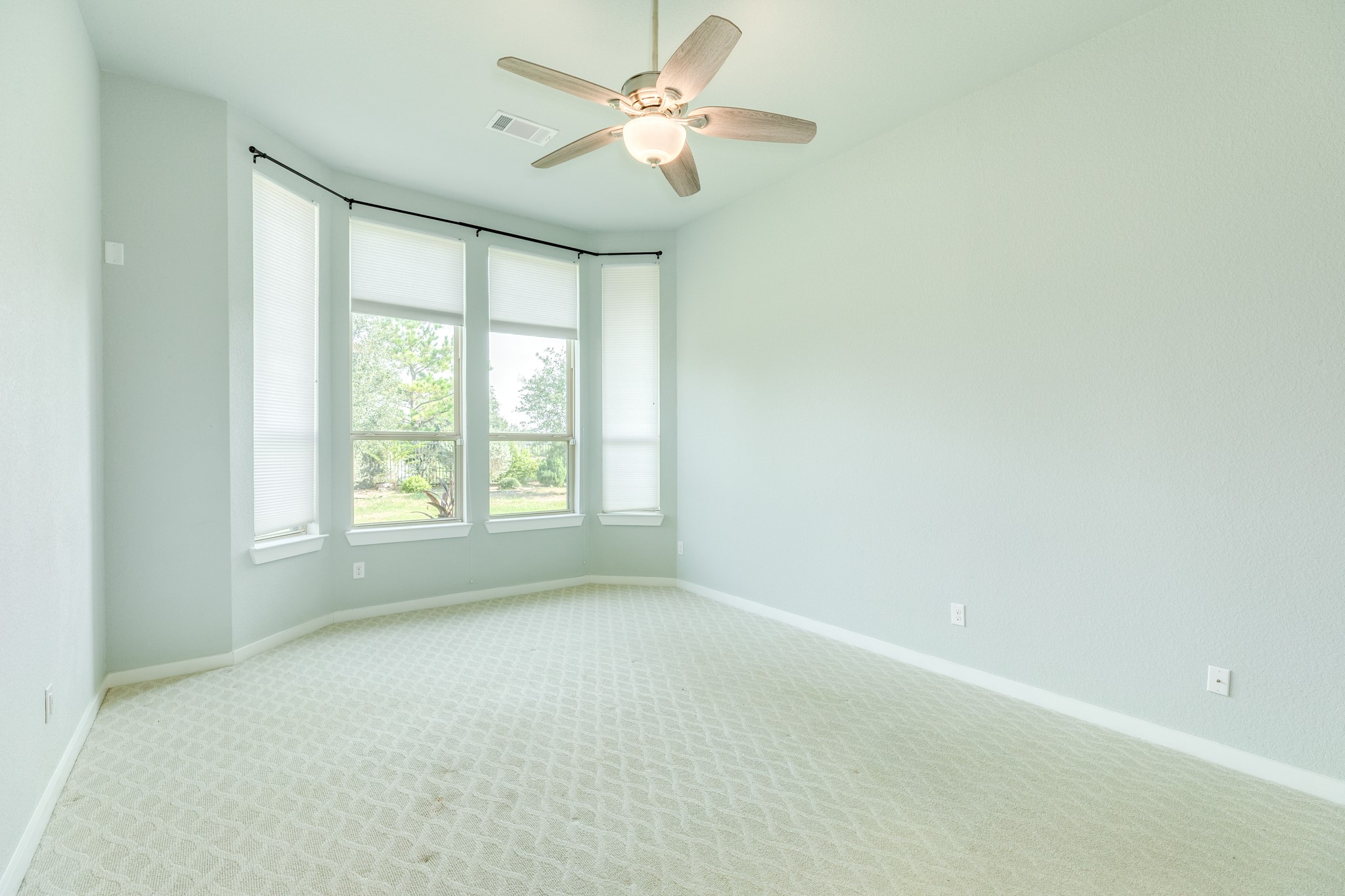 4015 Shackleton Court Iowa Colony, TX 77583 - Photo 18 of 50 Primary suite features elegant bay windows that offer a picturesque view of the serene outdoor scenery.