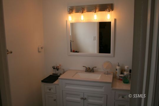 312 West Perdew Avenue Ridgecrest, CA 93555 - Photo 20 of 28 a bathroom with a sink and a mirror