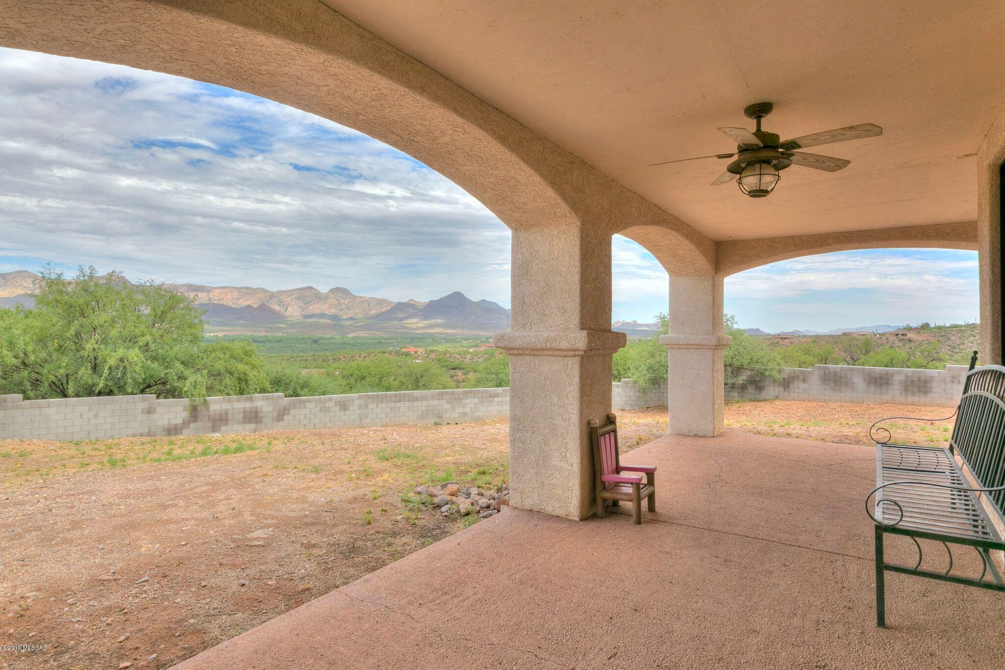 1648 Circulo Puerto Rio Rico, AZ 85648 - Photo 21 of 34 a view of a room with mountain view and a floor to ceiling window