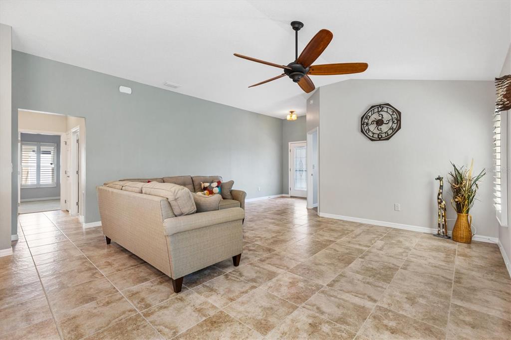 7351 Southeast 169th Cote Loop The Villages, FL 32162 - Photo 8 of 32 a living room with furniture and a window