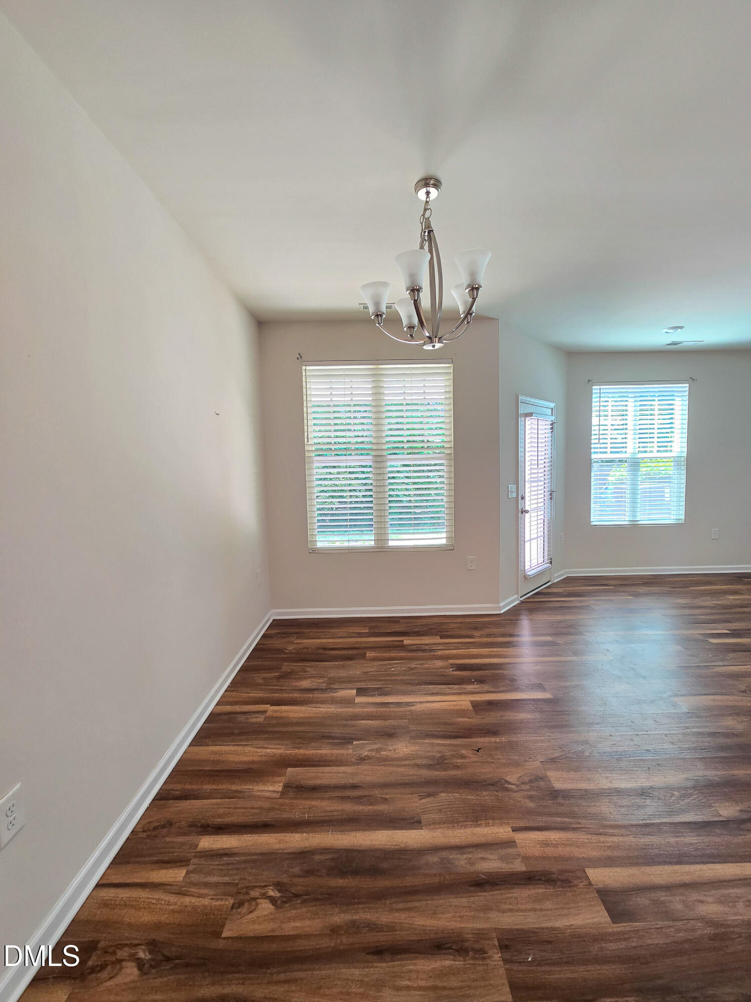 6145 Beale Loop Raleigh, NC 27616 - Photo 11 of 36 a view of empty room with wooden floor and fan