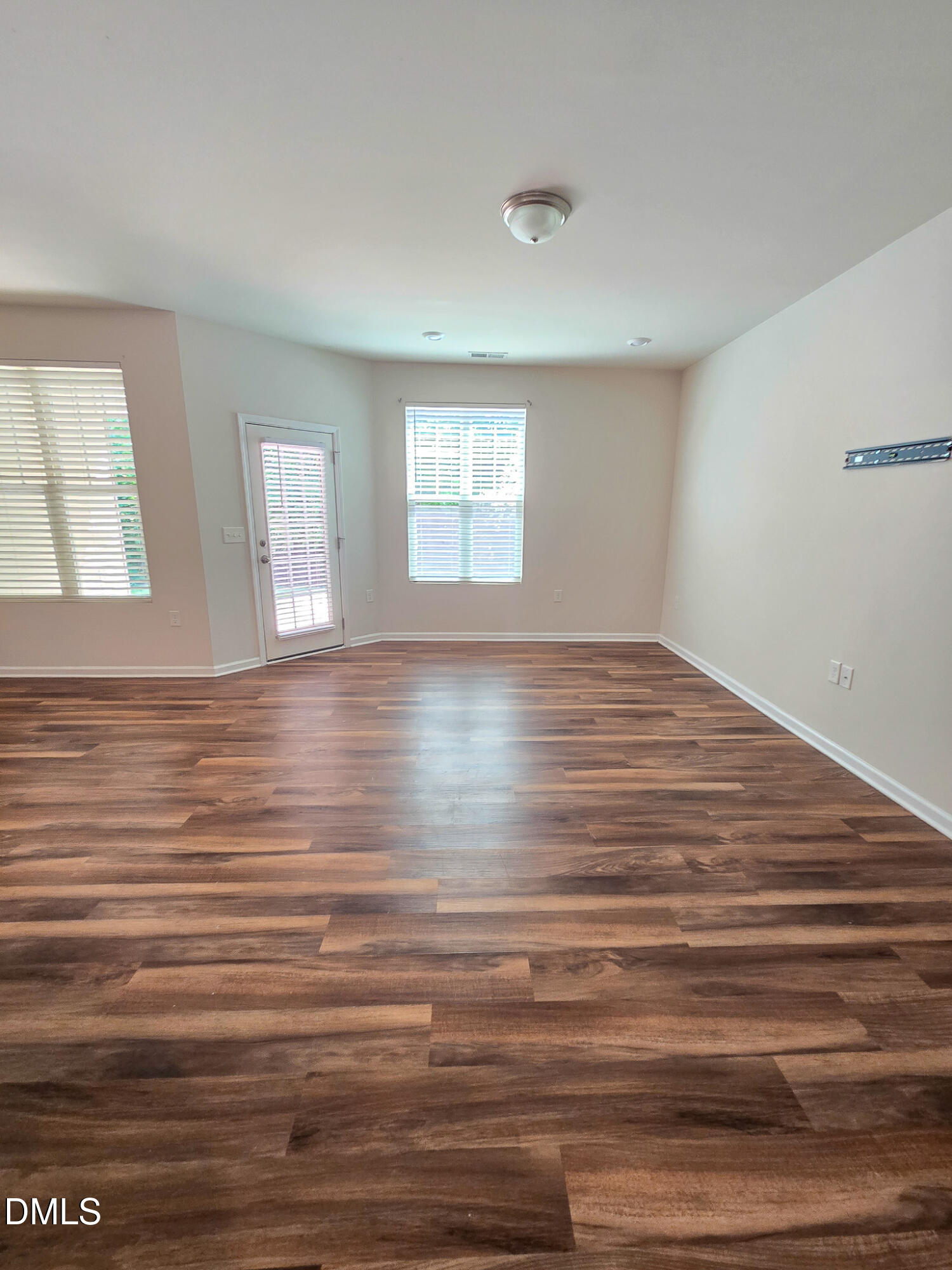 6145 Beale Loop Raleigh, NC 27616 - Photo 14 of 36 a view of empty room with window and wooden floor