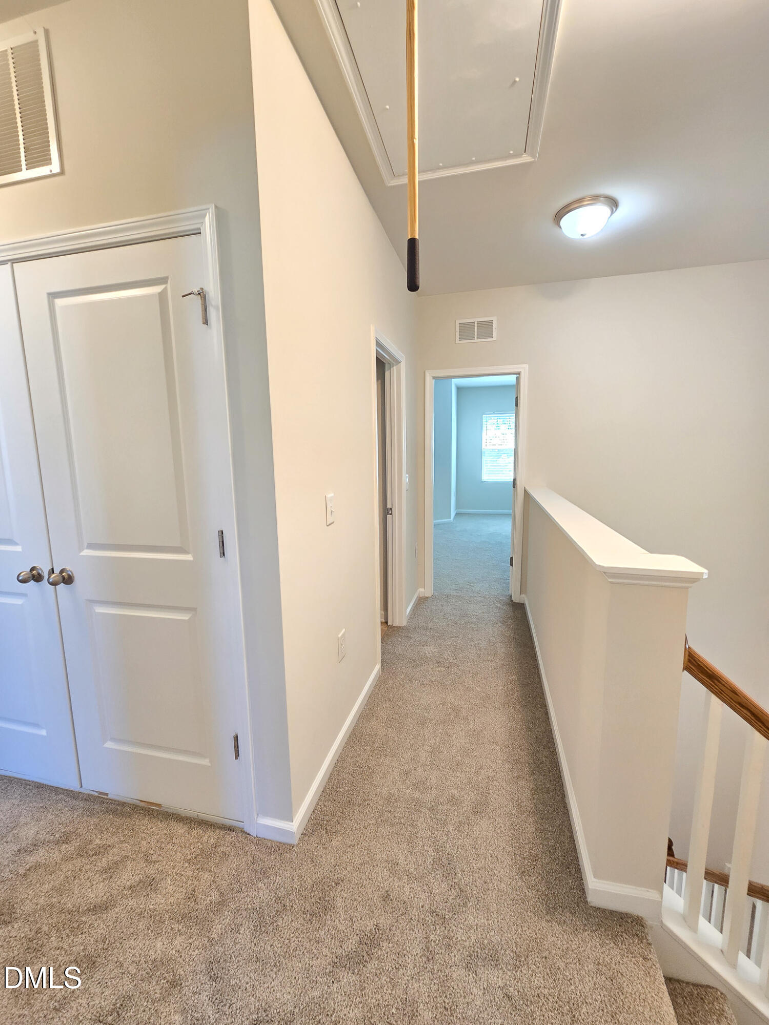 6145 Beale Loop Raleigh, NC 27616 - Photo 16 of 36 a view of hallway with stairs