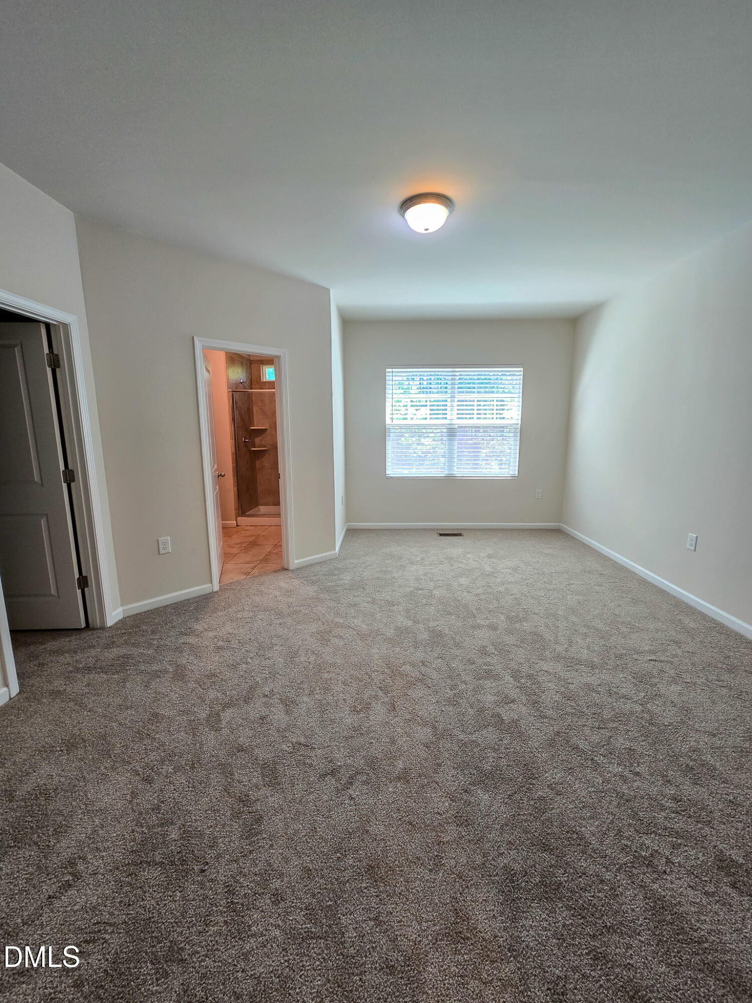 6145 Beale Loop Raleigh, NC 27616 - Photo 18 of 36 an empty room with windows and closet