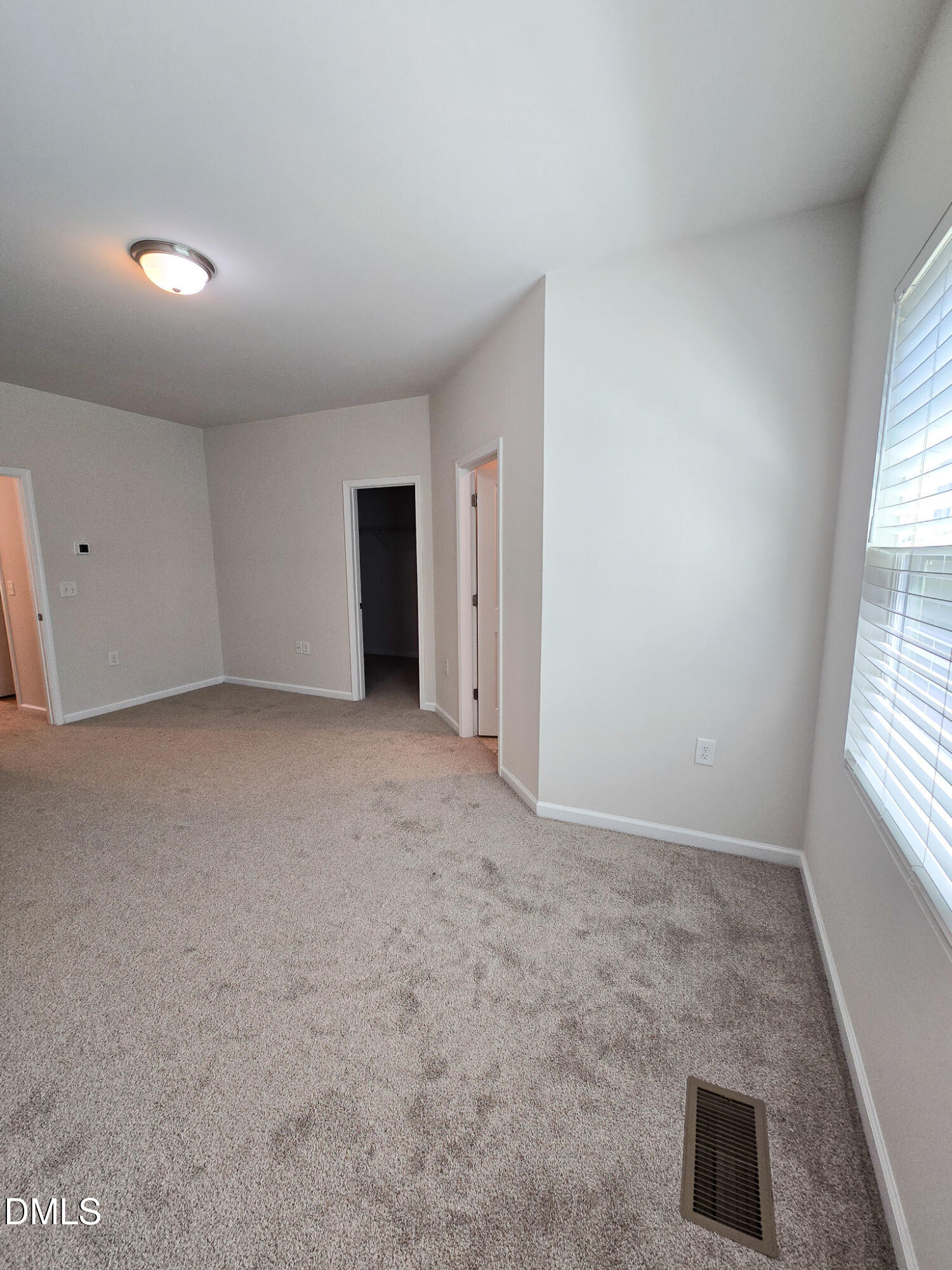 6145 Beale Loop Raleigh, NC 27616 - Photo 19 of 36 an empty room with windows