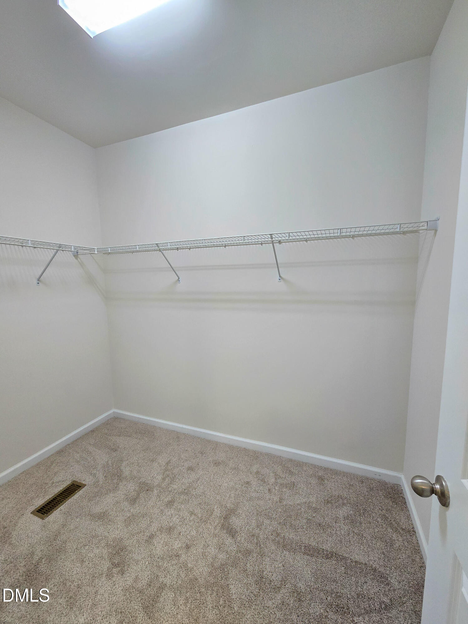 6145 Beale Loop Raleigh, NC 27616 - Photo 21 of 36 a view of a room with racks on the wall