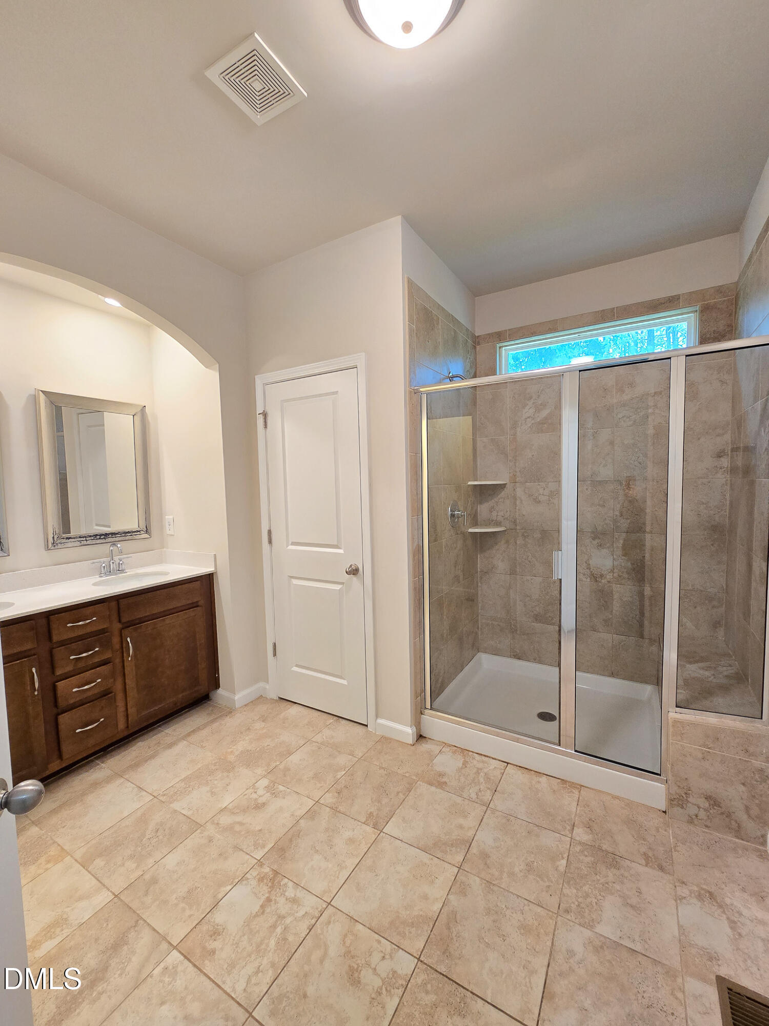 6145 Beale Loop Raleigh, NC 27616 - Photo 23 of 36 a bathroom with a glass shower door and a sink