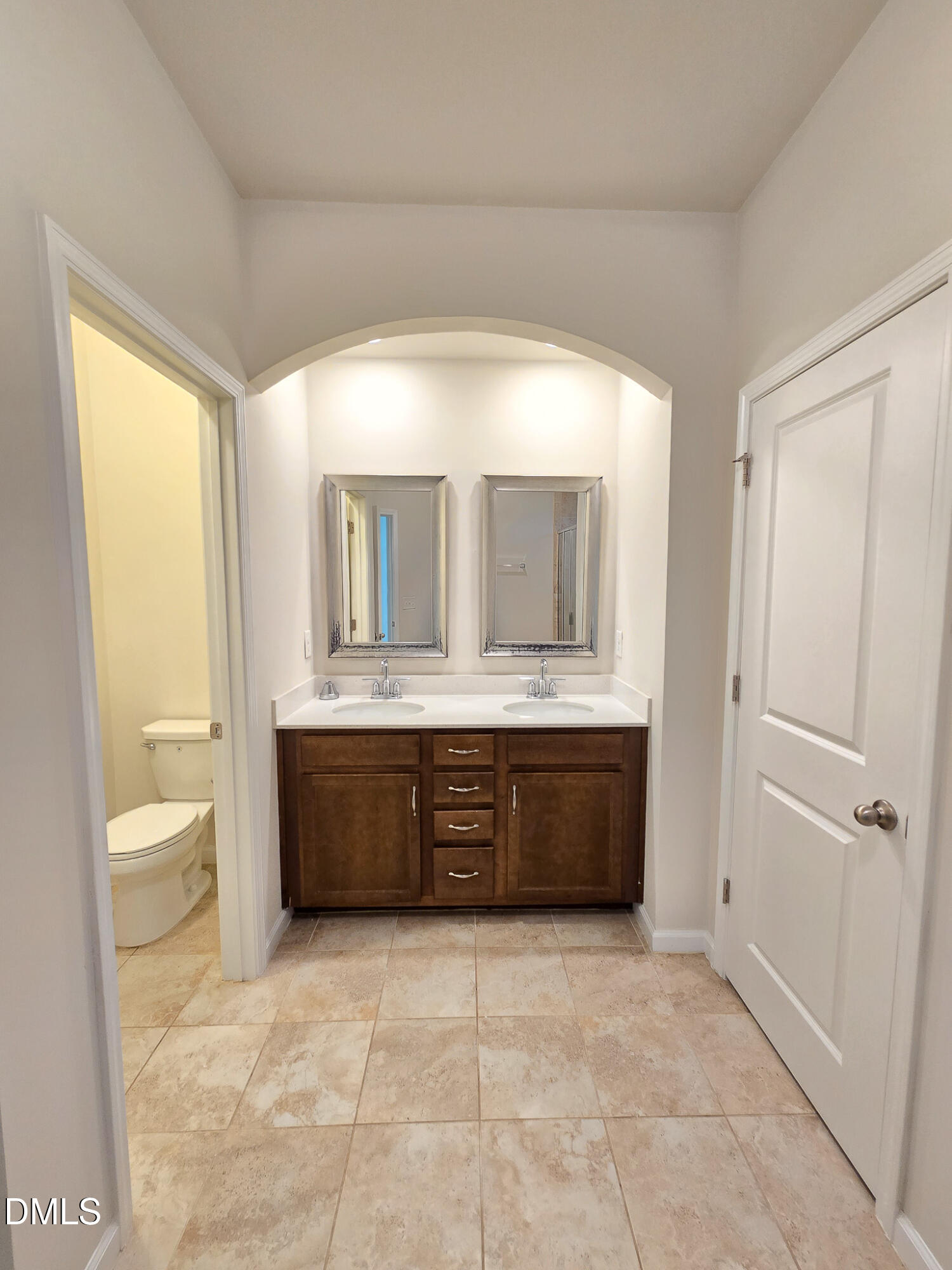 6145 Beale Loop Raleigh, NC 27616 - Photo 24 of 36 a bathroom with a sink a mirror and a bathtub